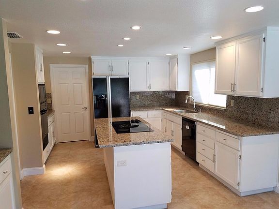 Lots of cabinet space, recessed lighting and granite kitchen counter.