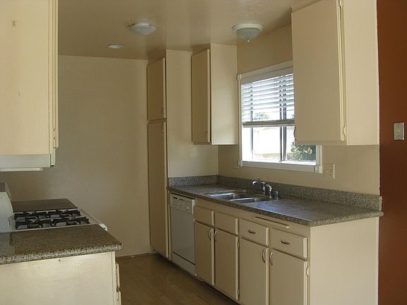 Granite counters in the kitchen, gas range, dishwasher and o