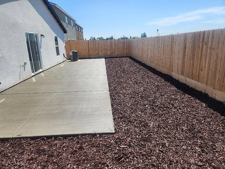 Back yard with concrete area for a gazebo