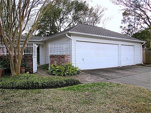 3 Car Detached Garage!! There is a nice workshop area and 2 doors leading to the back yard. It has also been plumbed for a sink or bathroom if you want to add that here
