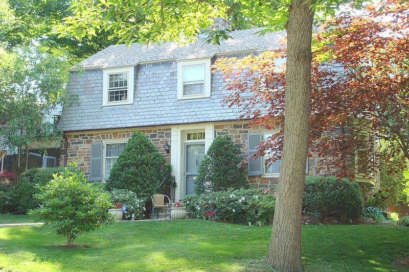 Stone and Cedar Sided Exterior with Slate Roof