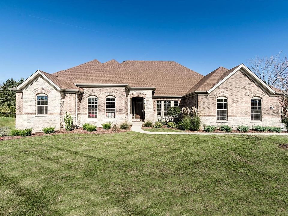 Front Elevation With Brick and Stone and Side Car Garage Entry