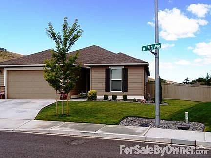 Front View 5744 W 17 Ave
						:
						Irrigated water, Rain Bird watering system with six stations