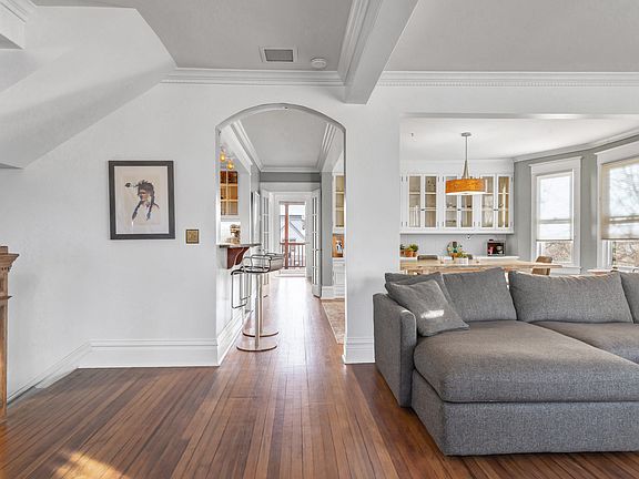 The top of the stairway leads to an open floorpan: living, dining and kitchen connected.