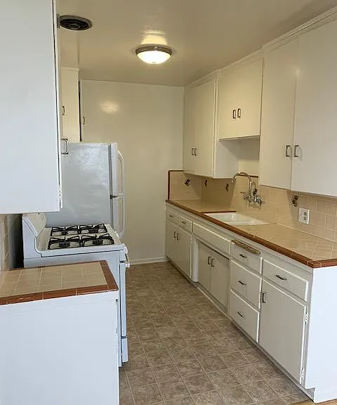 Kitchen with gas stove.