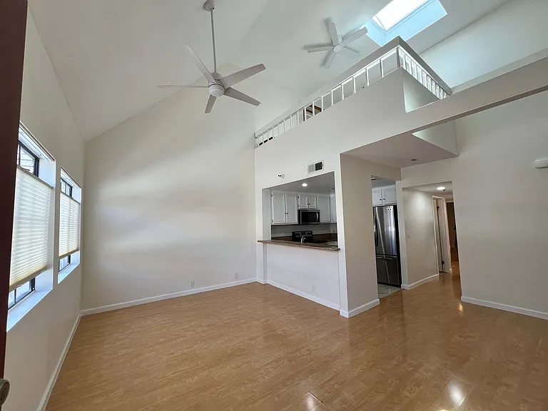 Bright open living area with loft sightlines