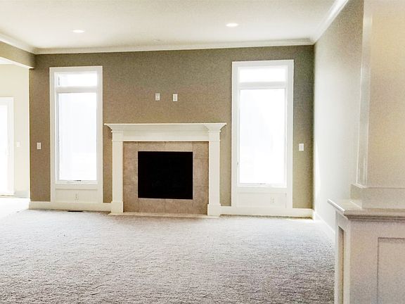 Great Room with Fireplace and pillars