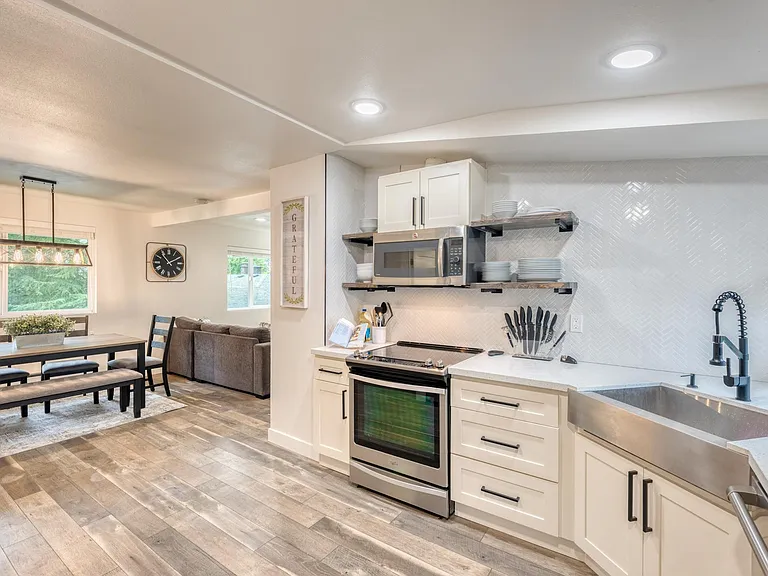 Remodeled Farmhouse theme kitchen with quartz counter top