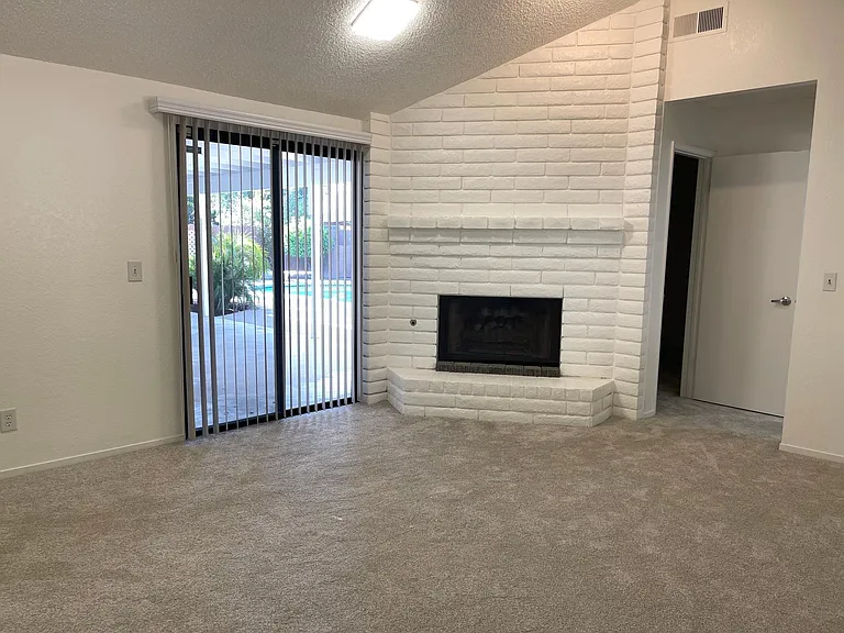 Master bedroom with an additional decorative fireplace and access to the pool,