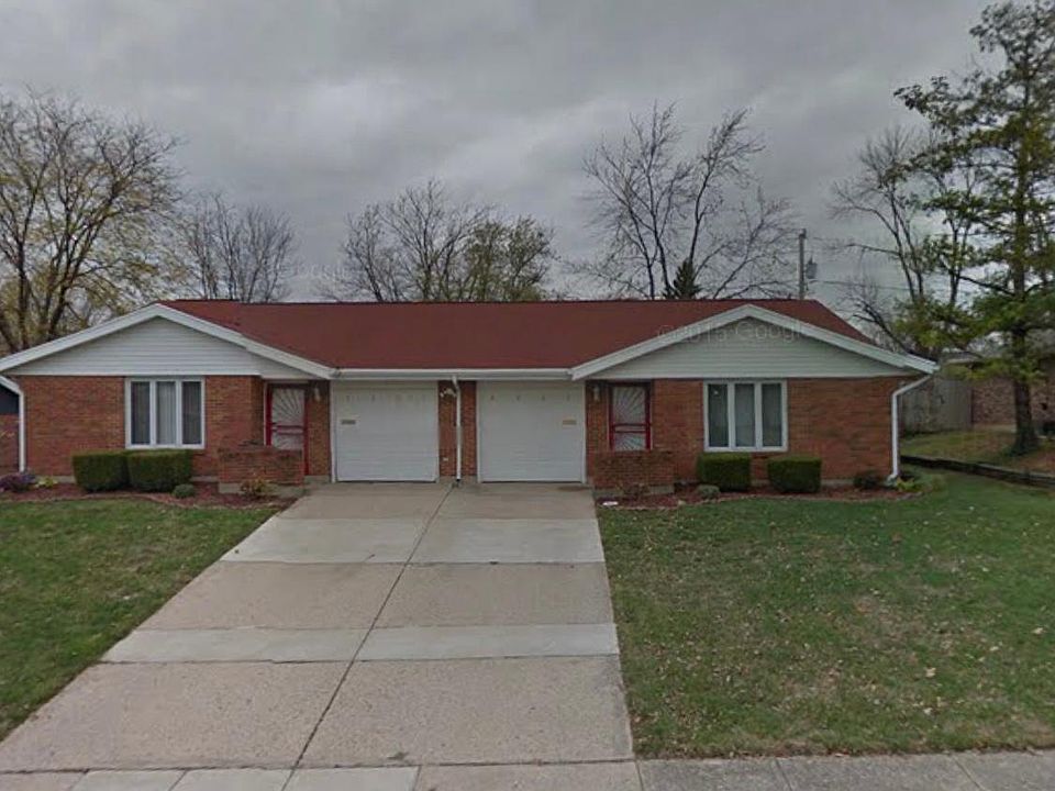 Front door with 2 car garage and 2 separate entrance.