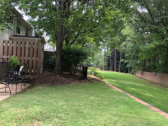 Green space adjoins patio