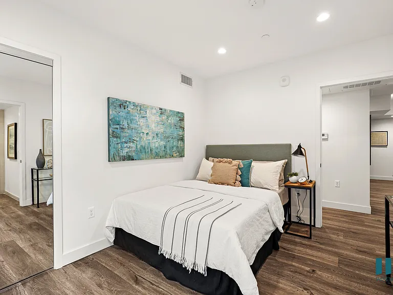 Bedroom with Mirrored Closet, Vinyl Flooring, and Recessed Lighting