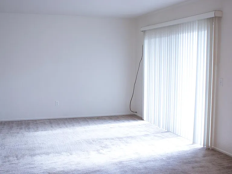 Living space with sliding door to private outdoor space (cable and internet ready). Open to dining room