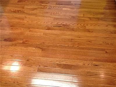 Charming kitchen with new hardwood floor, custom built cabinets with rotating shelves and Corian Counter tops