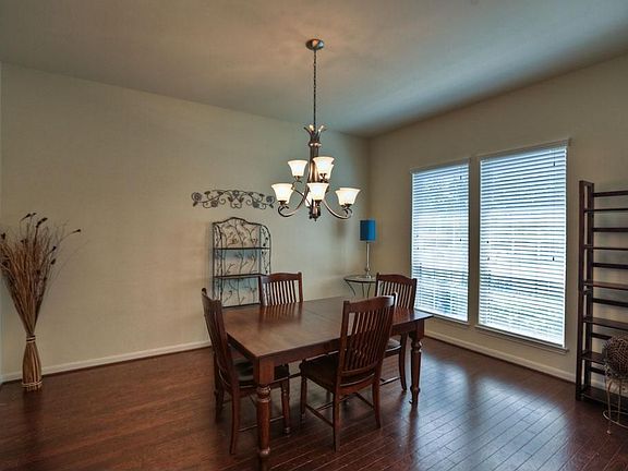 Enjoy family holiday meals in this spacious formal dining room. Beautiful wood floors and large picture windows.