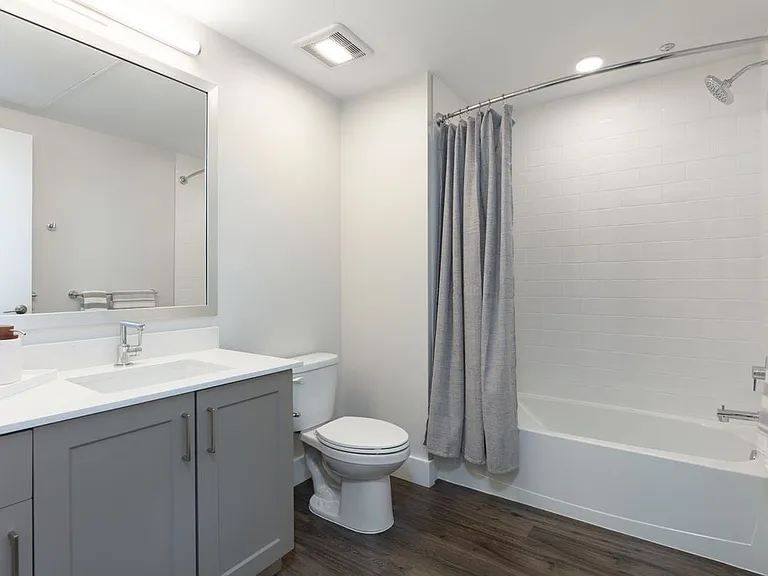 Finish Package II Bath with beige cabinetry, white quartz countertop, and hard surface flooring