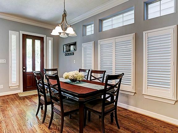 Leaded glass Mahogany Front Door and Transom Windows add lots of natural light.