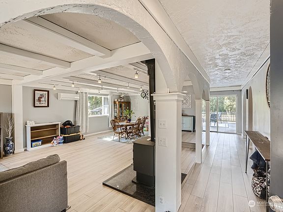 Wow!  All new flooring, beamed ceilings and open floor plan>