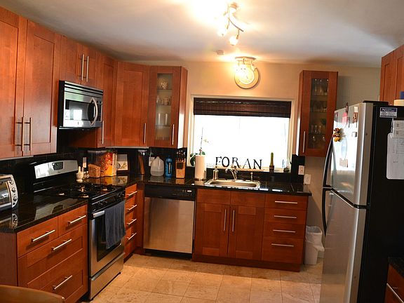 Beautiful renovated kitchen with granite counter tops and st
