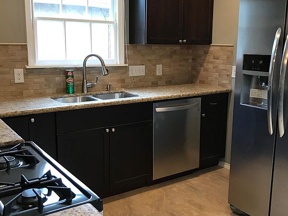 New appliances, ample countertop space, and deep double sink