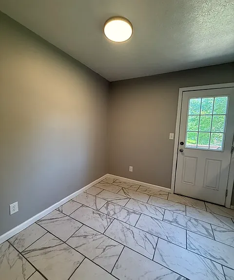 Kitchen - Dining Area - Door leads outside to small deck