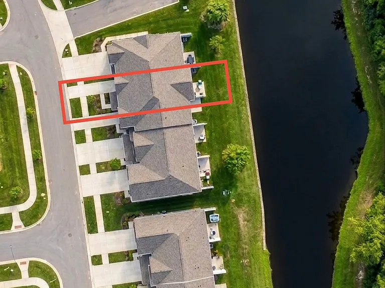 Backyard Overlooking Retention Pond and Woods