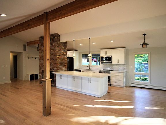 House # 1 - Open and airy layout - Updated Kitchen, Dining Area and Living Room with gas fireplace.