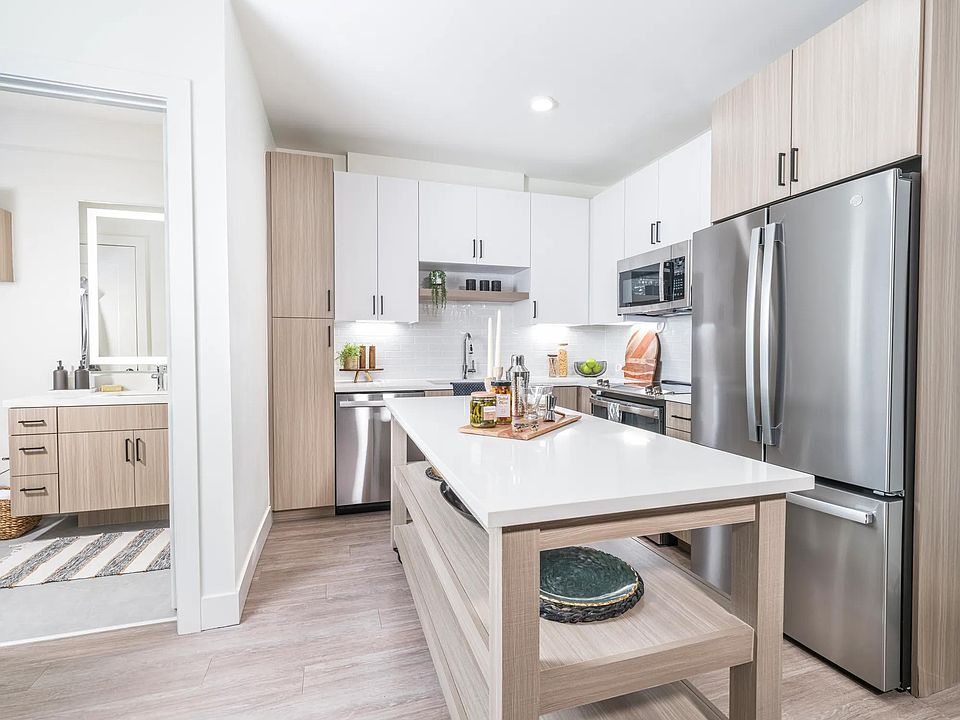 Creating culinary magic with a chef's dream island complete with ample storage, found in the heart of Modera Golden Triangle, Denver, Colorado.