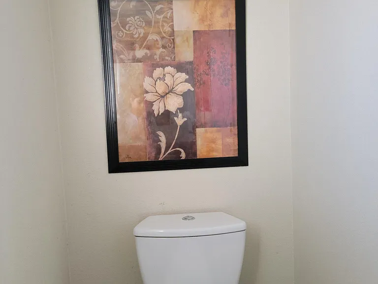 Half bath room on the main floor next to the laundry closet