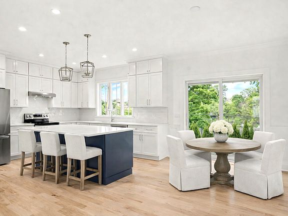 Gourmet Kitchen with Breakfast /island and expansive glass sliders to private patio