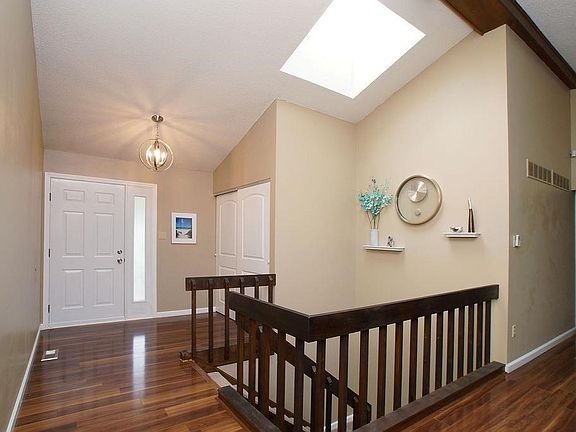 Light filled entry foyer welcomes guests into home.