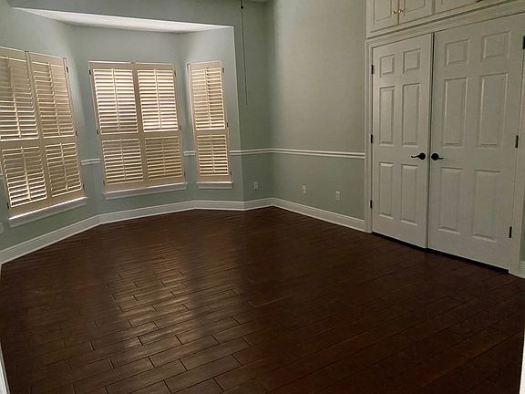 First bedroom with windows to the front of the house