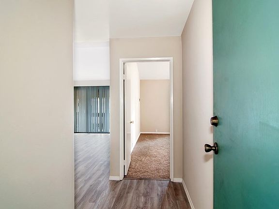 Entry to Condo w/ Hall Closet Behind Front Door for Ample Storage