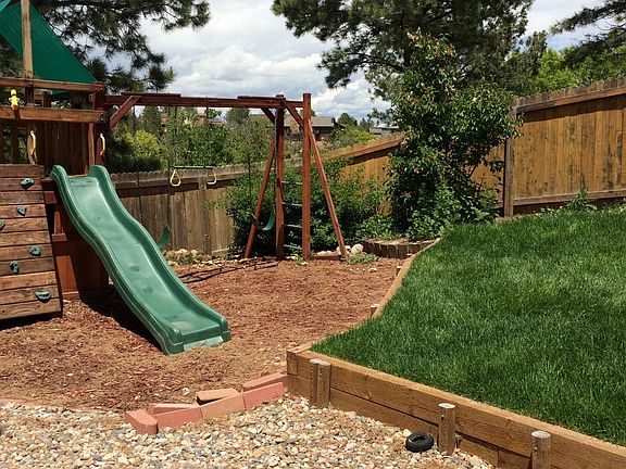 Fenced side yard with custom play set