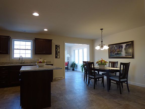 kitchen, dining area. Photo from similar home.