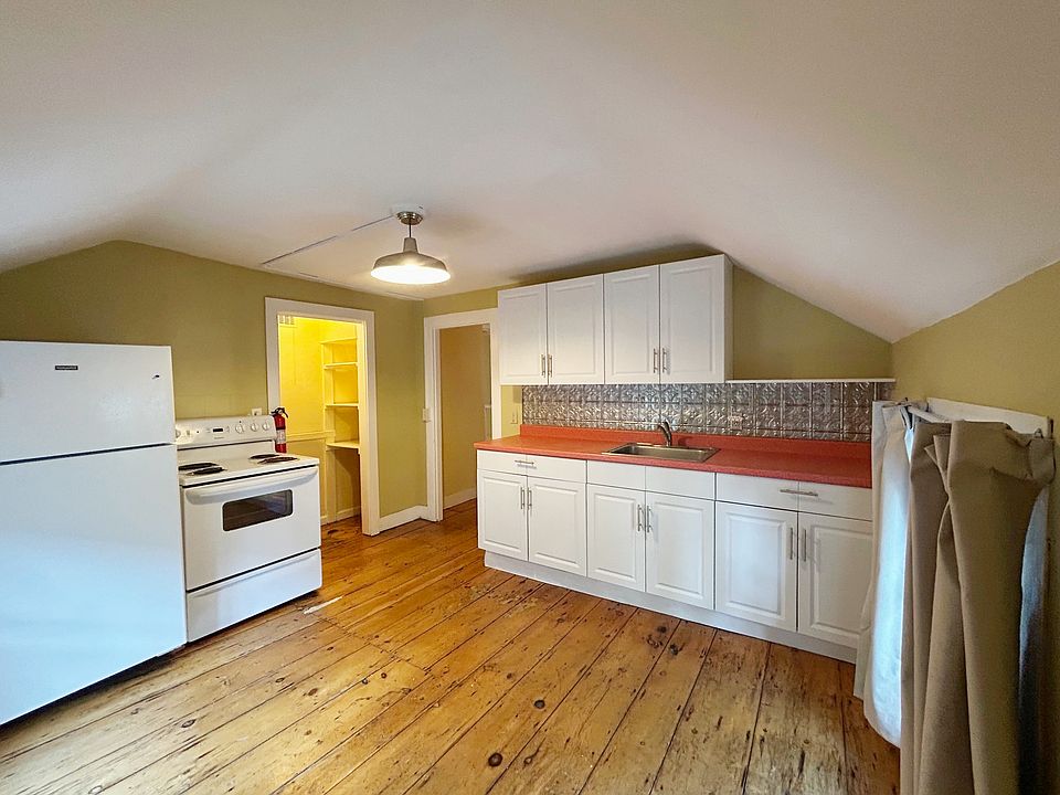 Kitchen, showing sink, cabinetry, brand new 'fridge, stove and pantry
