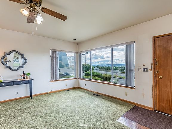 Corner Window Features Southern & Western Views from the Living Room.>