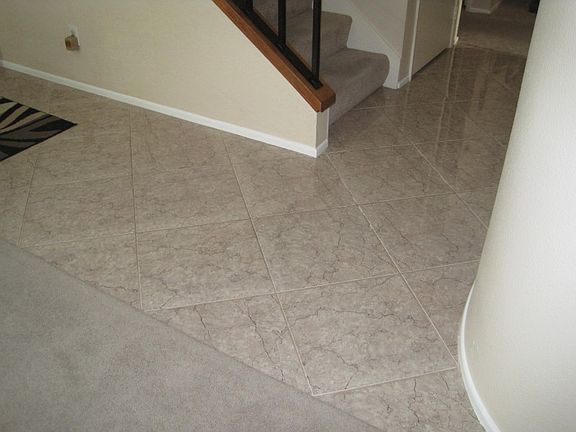 Tile entry, kitchen, powder.