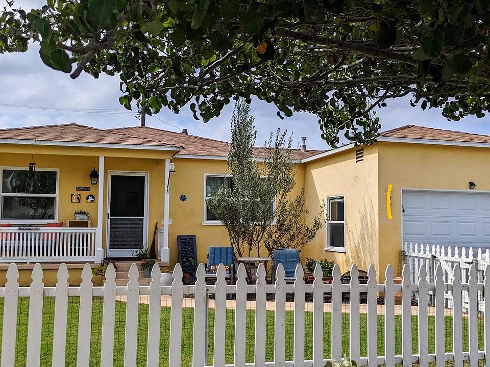 Front yard, porch, driveway, garage