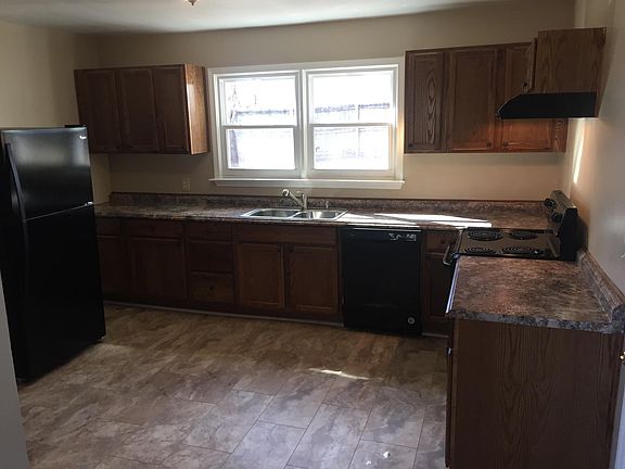 Kitchen view from den. All new cabinets, flooring, & applian