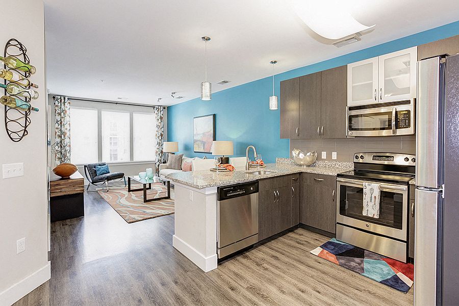 Kitchens feature stainless steel appliances, kitchen islands (in select homes) and luxury vinyl plank flooring
