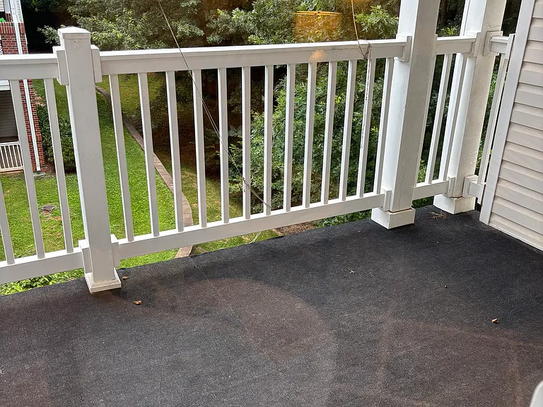 outdoor deck beside dining table and chairs