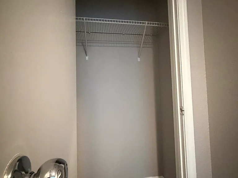 Spacious entryway closet for shoes, coats, and everyday storage.