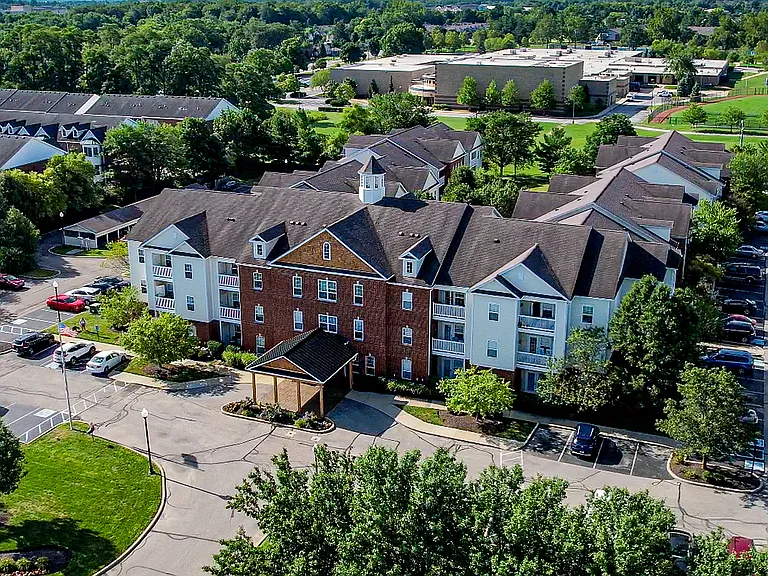 A bird's-eye view of home_The Gallery's welcoming entrance, classic architecture, and tree-lined surroundings set the tone.