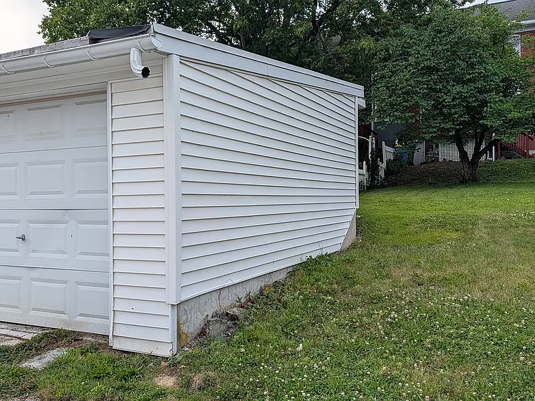 A one-car detached garage is at the rear of the property.