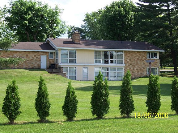 Standing on the sidewalk on back of lot line