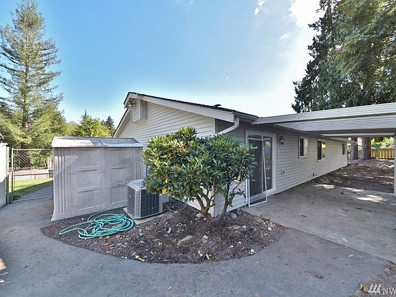 Spacious clean backyard is just waiting for a loving touch to make it really stand out. Nice covered patio with sliding doors that lead to dining and kitchen area is great for entertaining. 