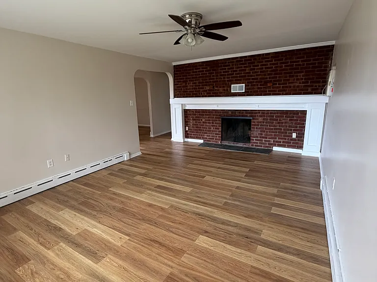 Living room with fire place and mantle