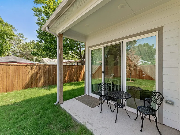 The small patio in the back yard, and a storage room available for long-tern tenants.