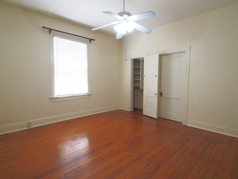 Middle Bedroom with built in closet, custom wood blinds. Shared bathroom with 1st bedroom